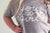 T-shirt girocollo in cotone grigio jogging a manica corta. con scritta stampata ad acqua in bianco YOU GO GIRL.